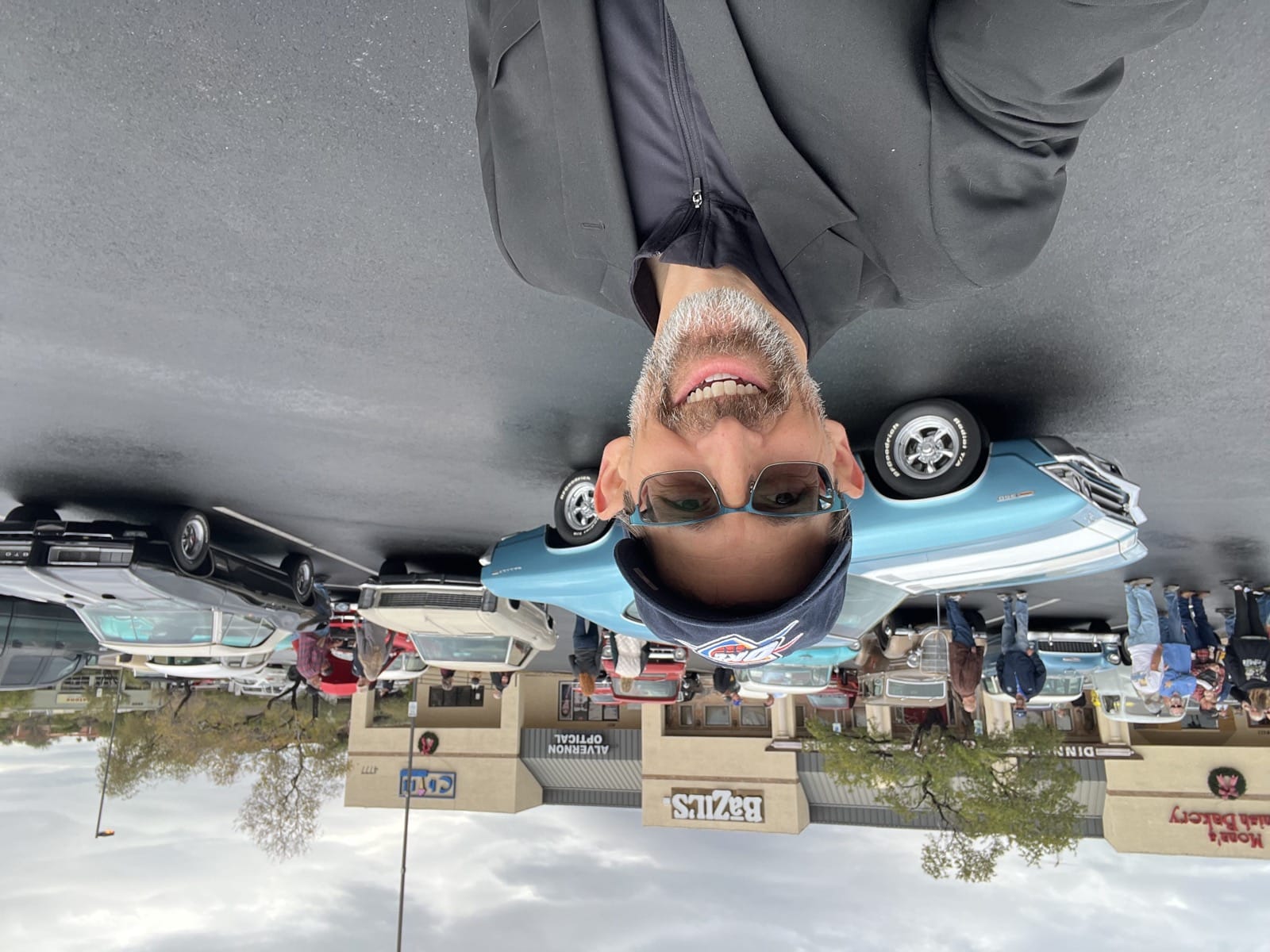 Tim at a car show with a classic